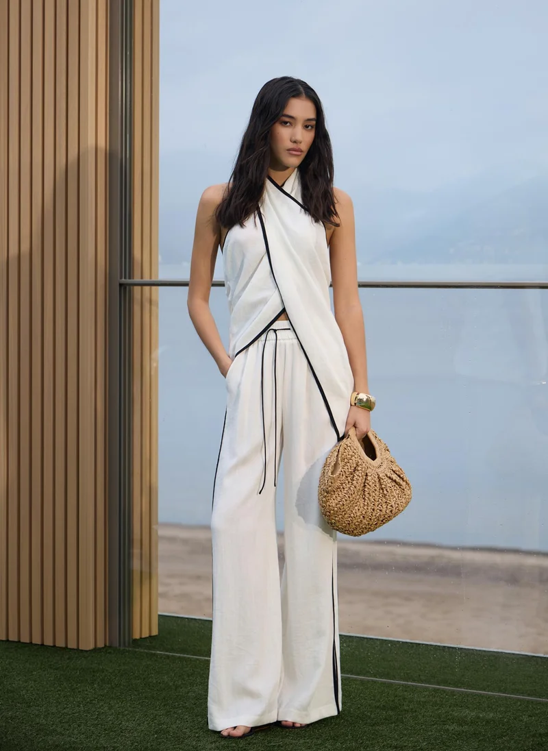 Lichi Draped top with halter collar and contrasting edging